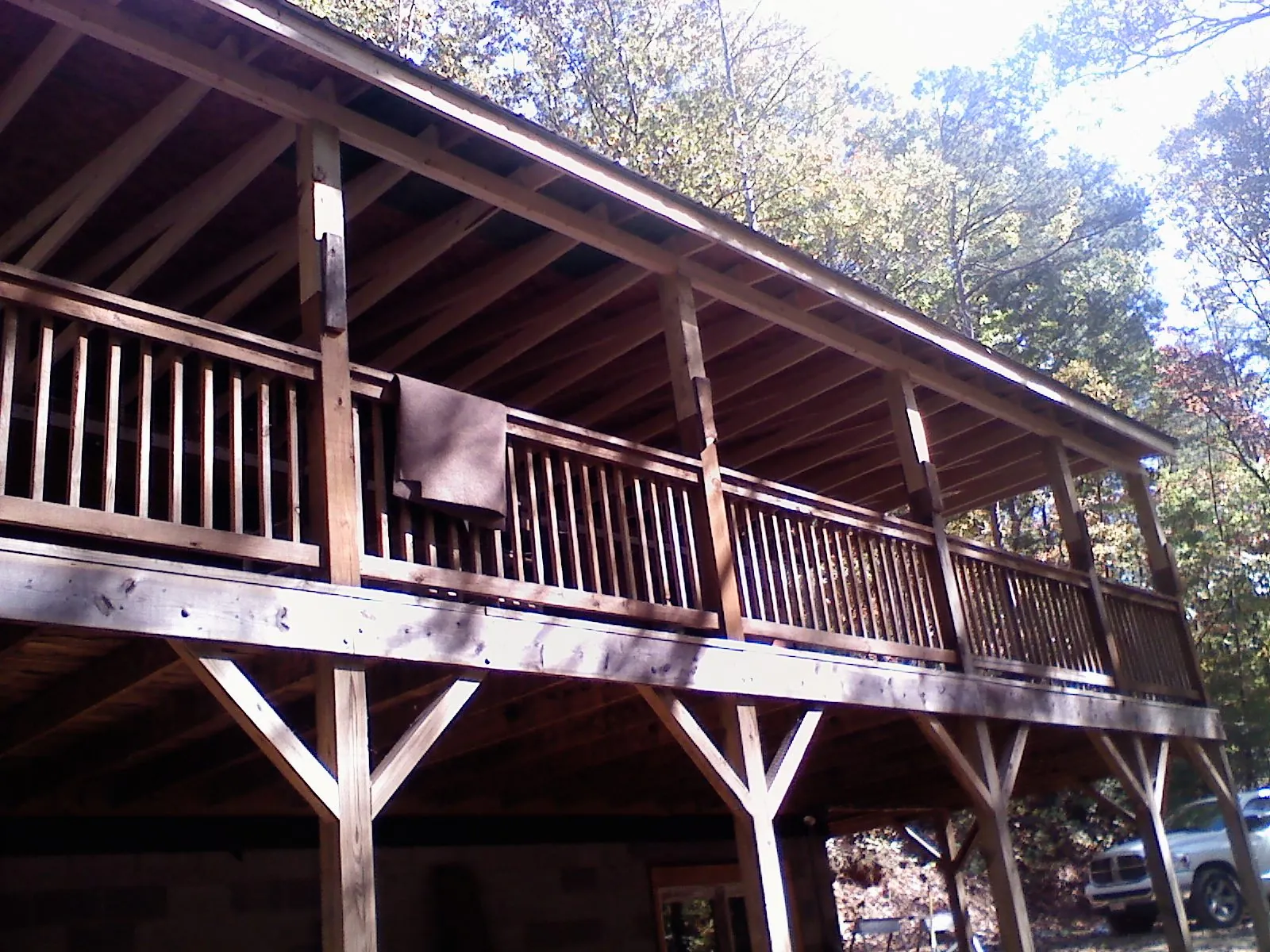Timber framing under a new elevated porch and deck — Roof Leak Repair in Jerico Springs by Roofing Brothers